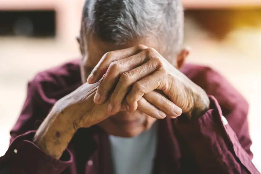Elderly Man Hands Face Suffolk County New York in Suffolk, New York