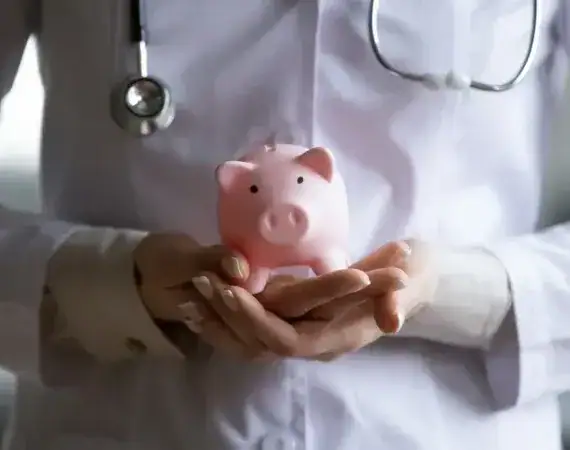 Therapist Holding Piggy Bank Suffolk County New York in Suffolk, New York