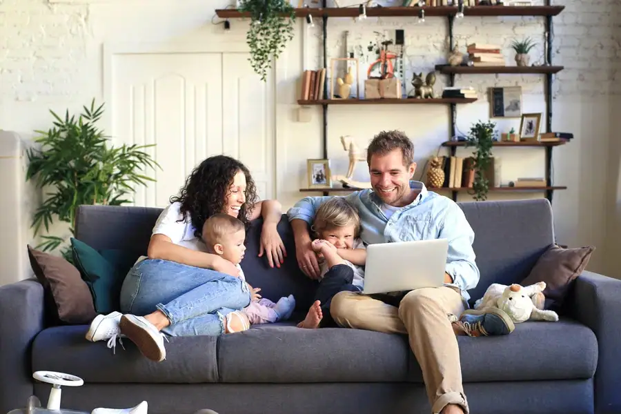 Happy Family On Couch Suffolk County New York in Suffolk, New York