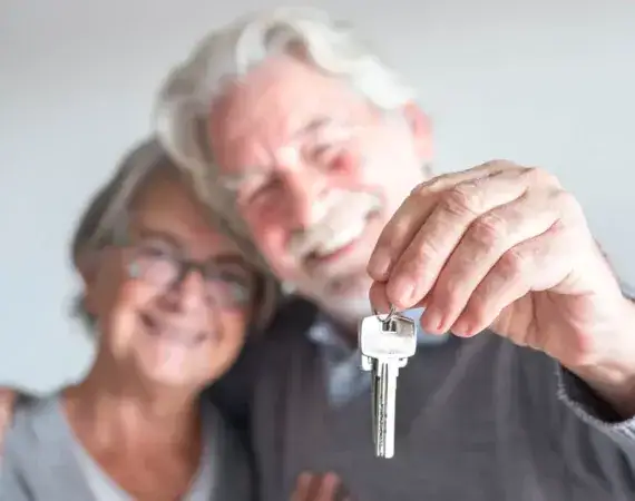 Senior Couple Holding Keys Suffolk County New York in Suffolk, New York